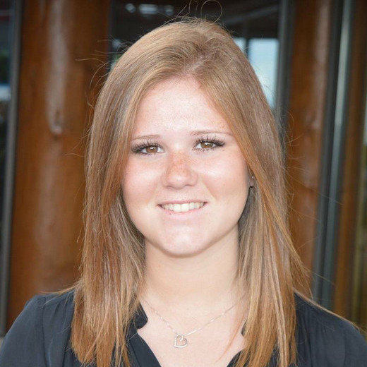 Headshot-style photograph of Dr. Katrina Carbone
