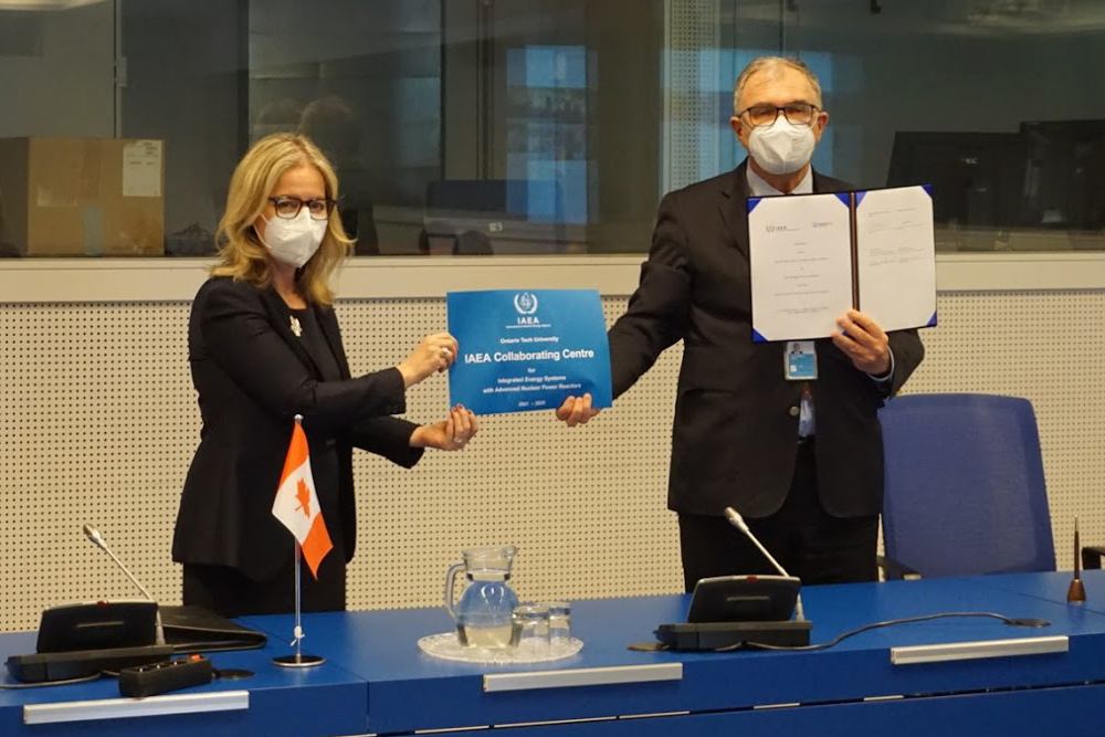 Heidi Hulan, Ambassador of Canada to Austria, and Chair, IAEA Board of Governors (left) and Mikhail Chudakov, UN IAEA Deputy Director General and Head of the Department of Nuclear Energy hold plaque confirming Ontario Tech University's designation as an IAEA Collaborating Centre (virtual ceremony in Vienna, Austria, April 22, 2021).