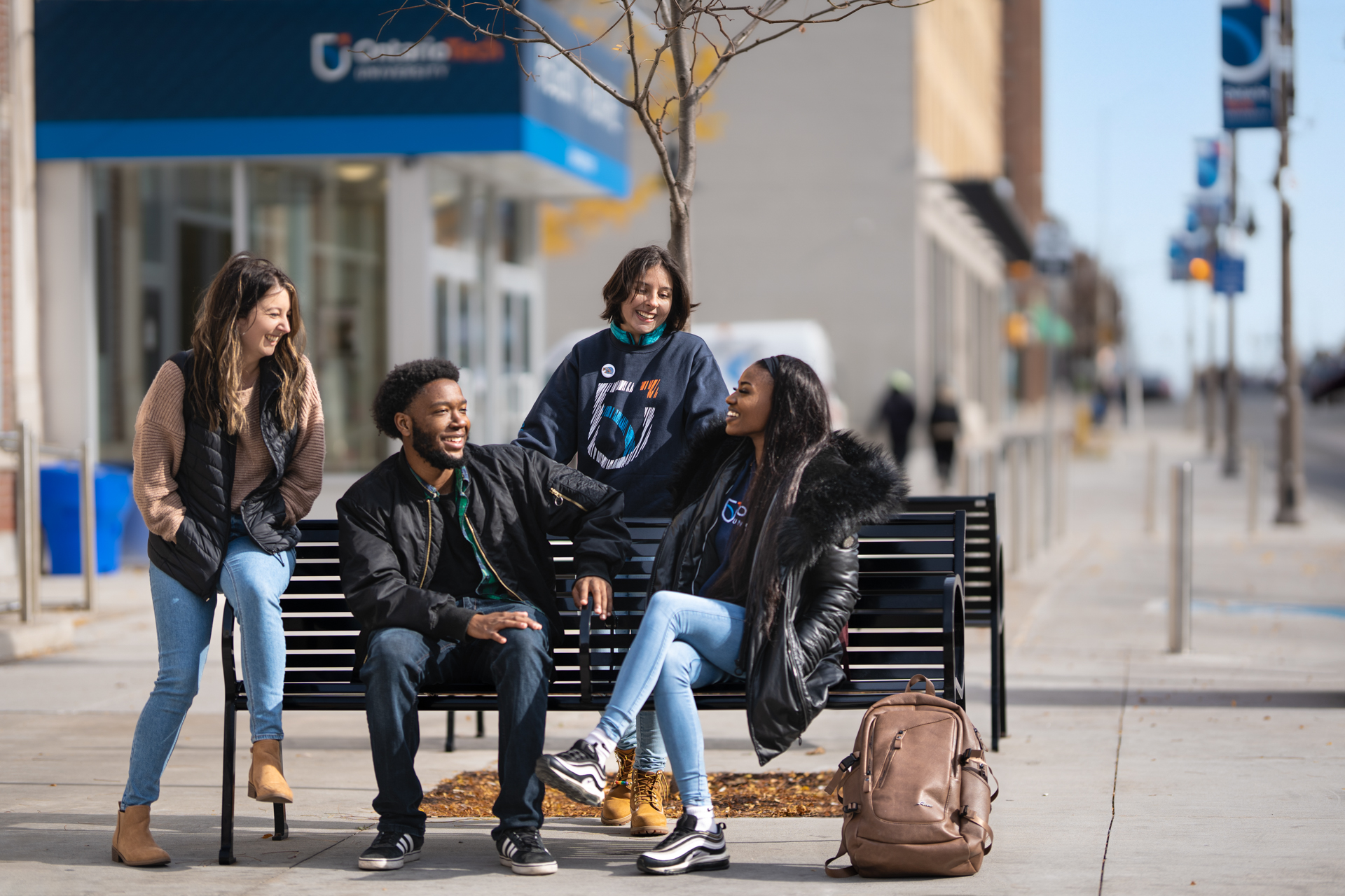 Multiracial group of teenagers using phones