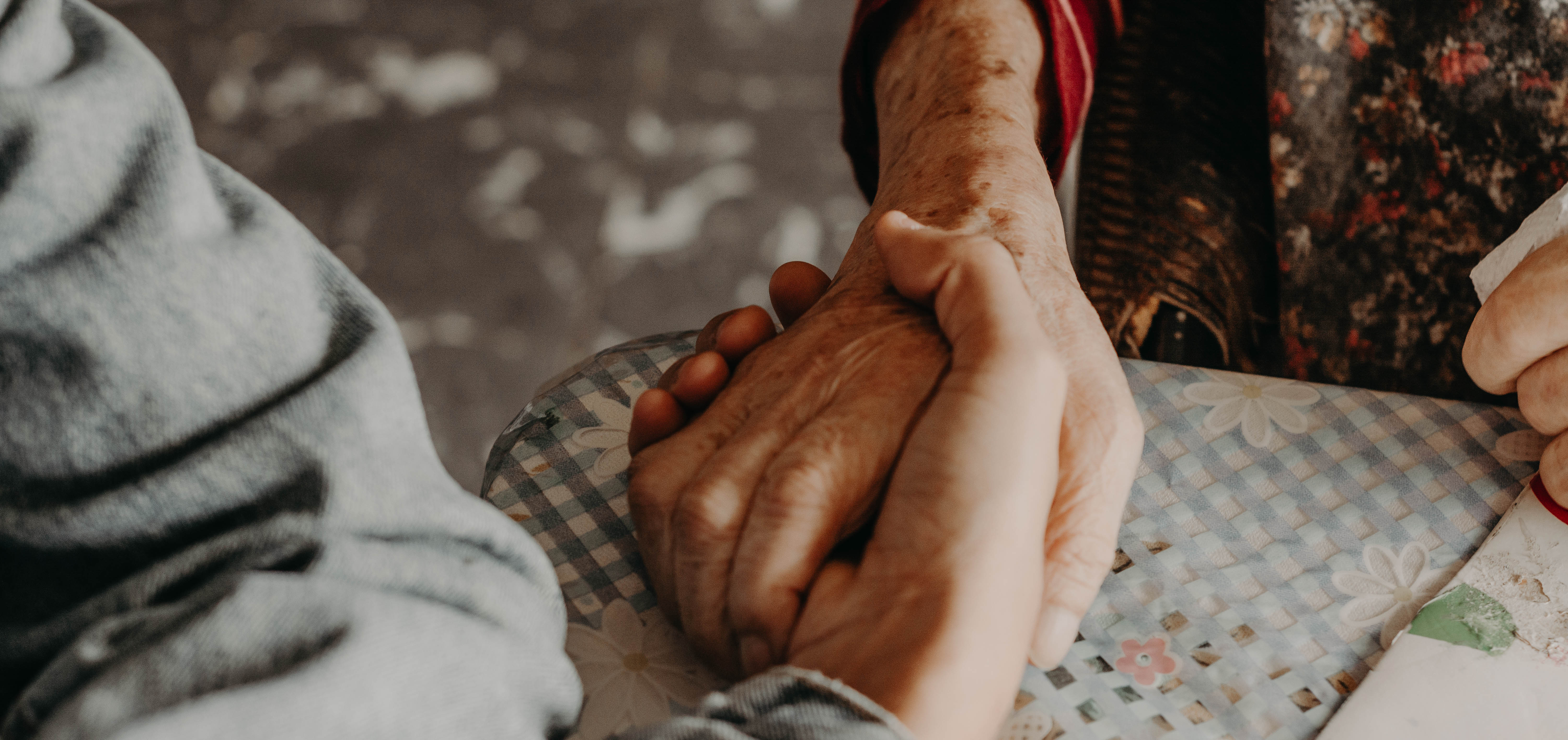 Young carer holding hands