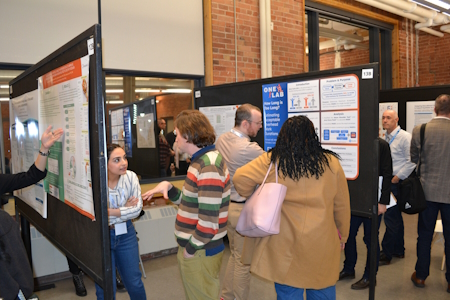 Students presenting posters at the Fall Discovery Showcase