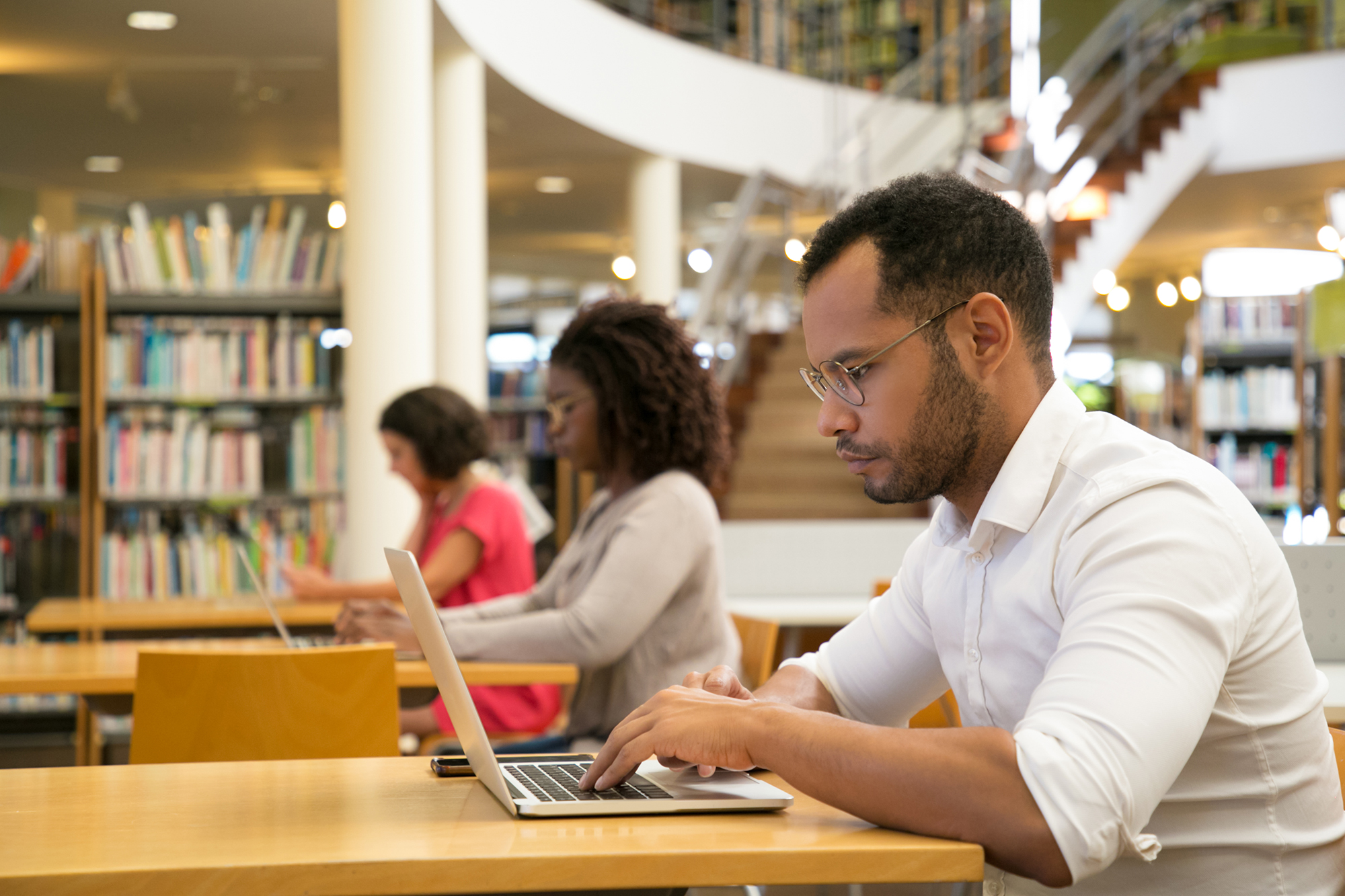 A student is seen studying in the library.