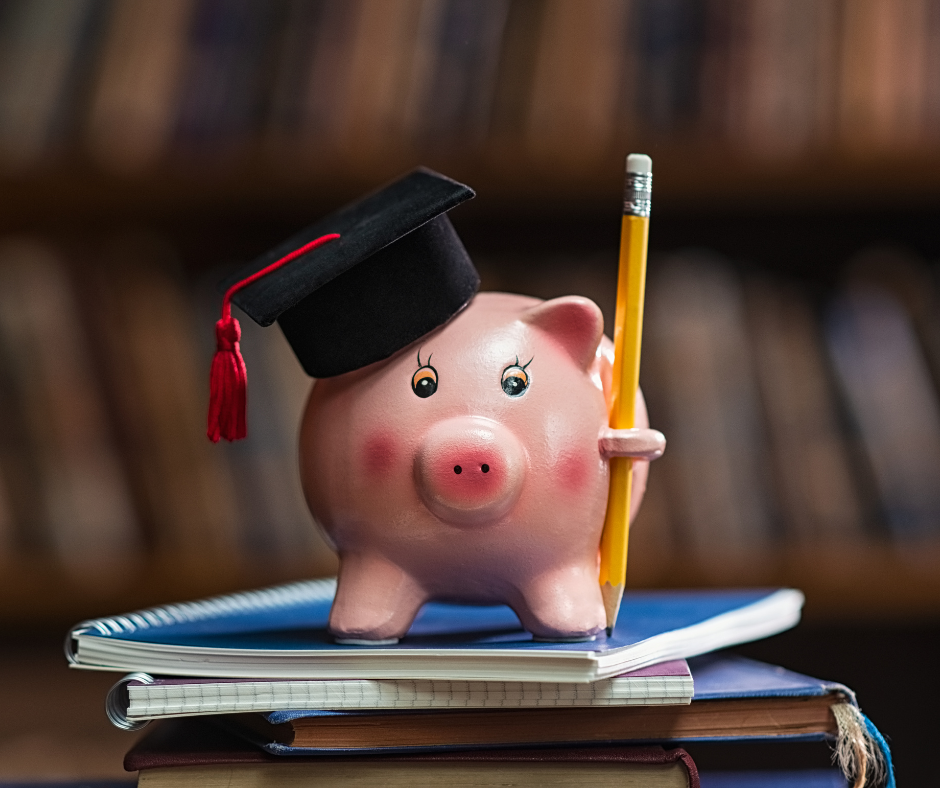 An image of a piggy bank on top of books with a grad cap on.