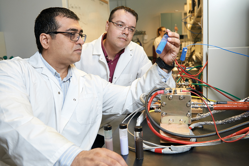 Researchers work on materials characterization in a lab.