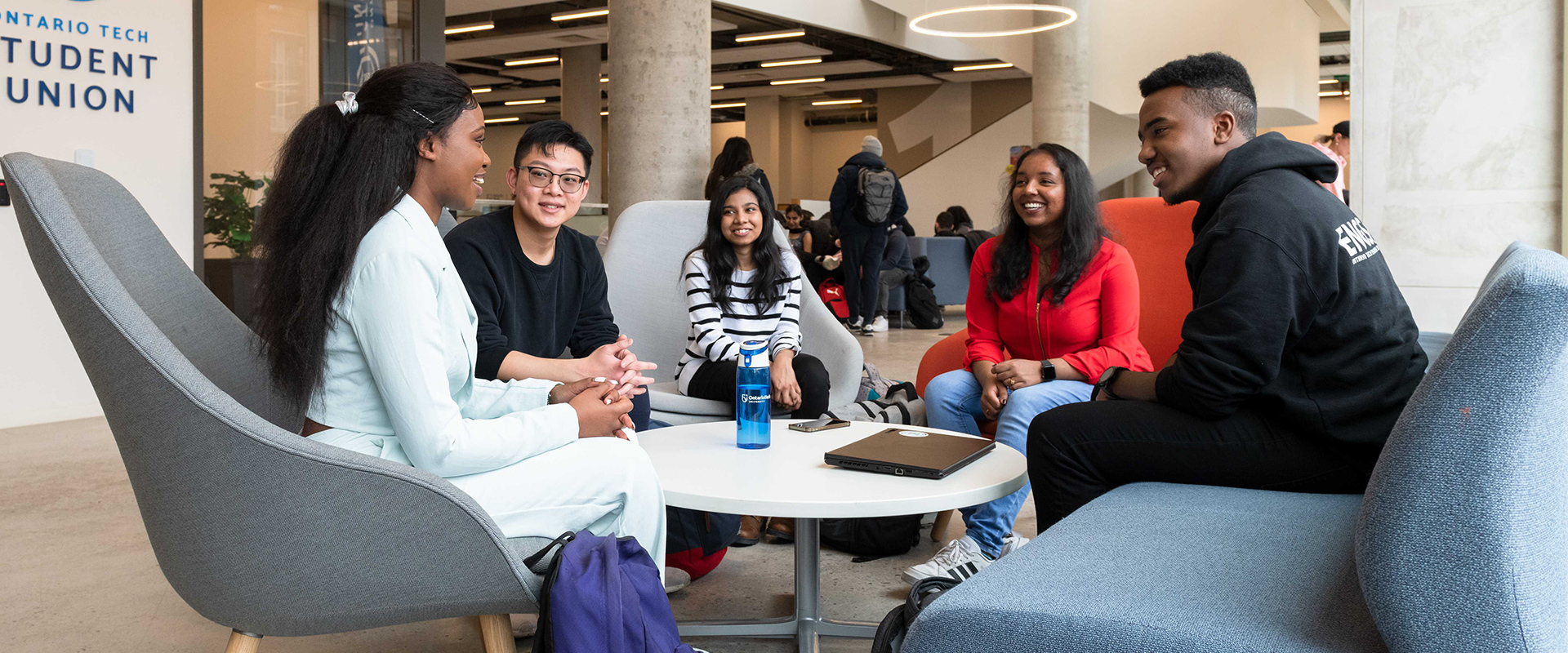 Students lounging in Shawenjigewining Hall