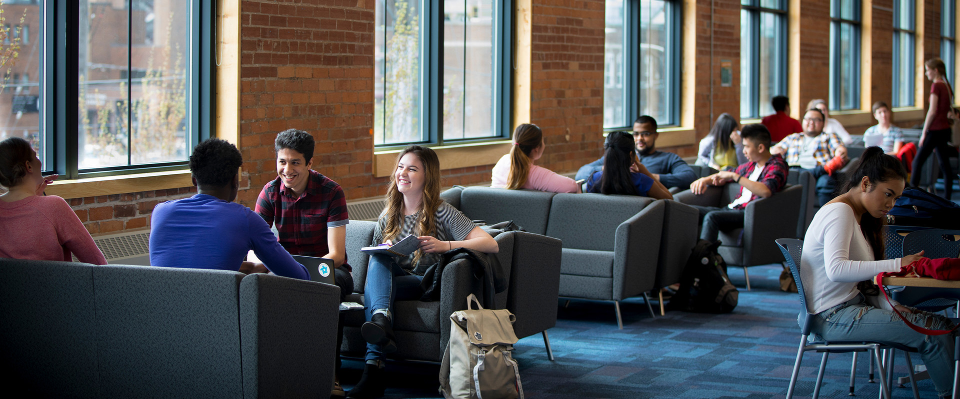 Students lounging and studying on couches in Charles Hall