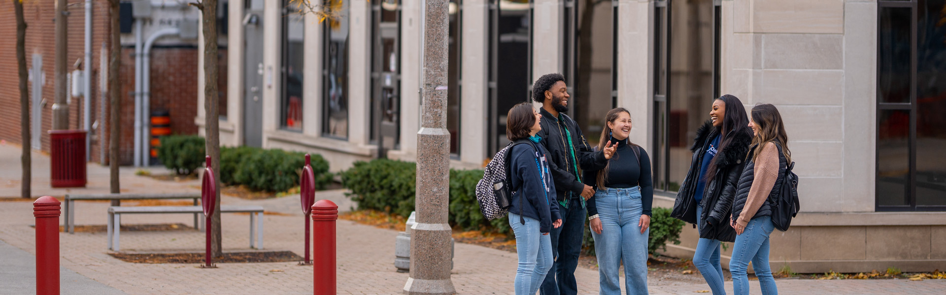 Students outside in the fall in the downtown campus