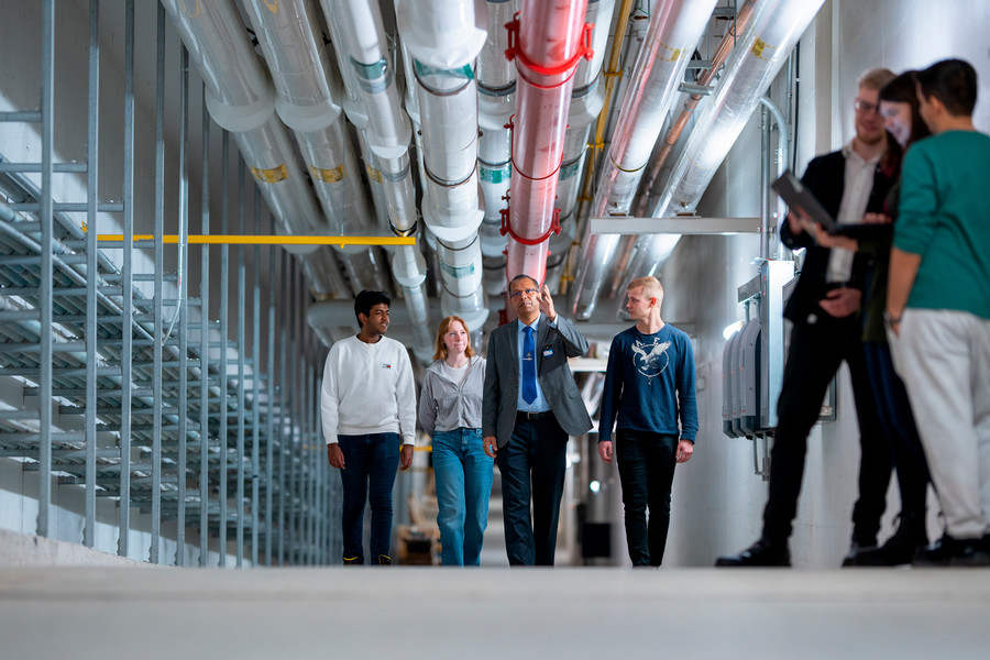 People walking in teaching lab.