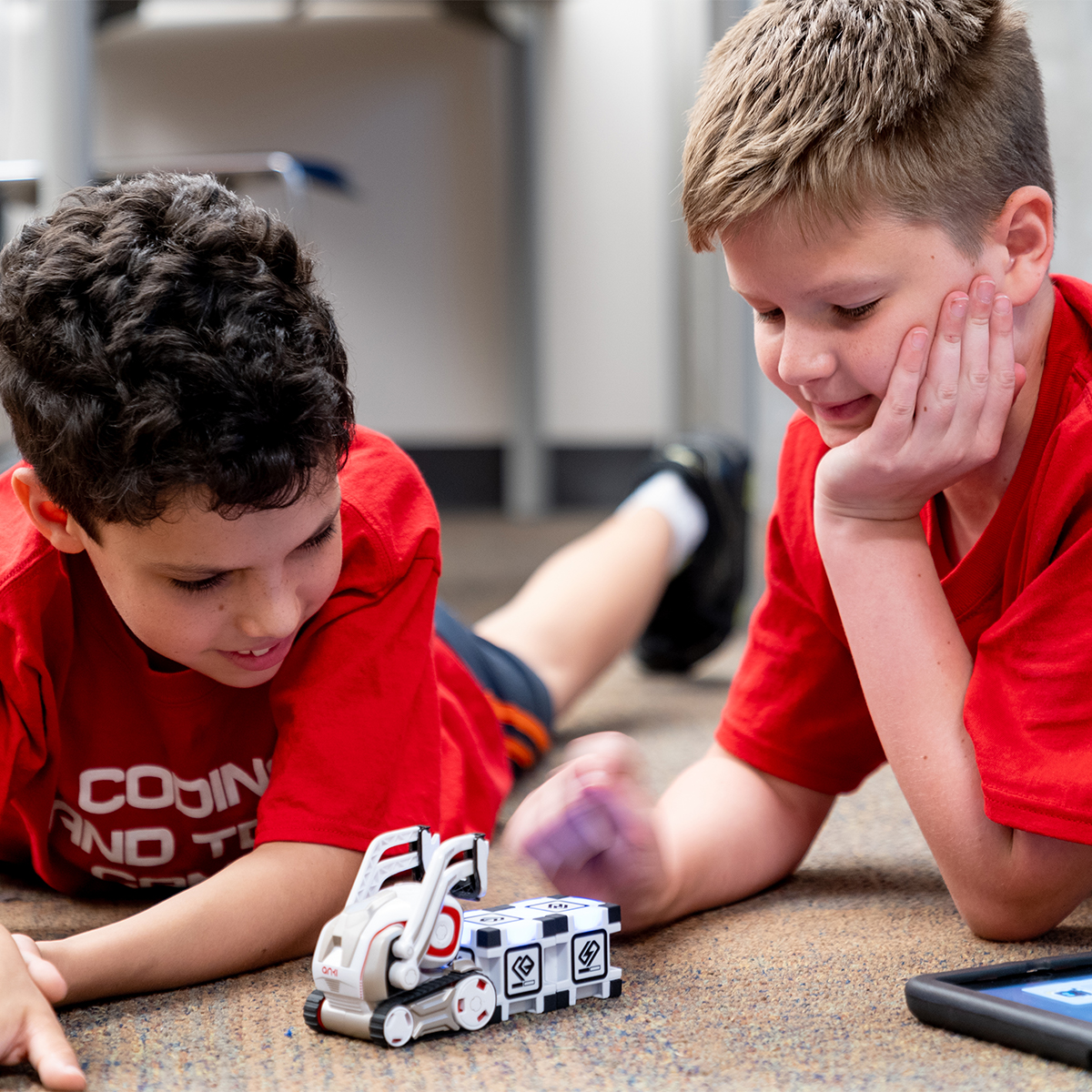 Kids at camp playing with robotics